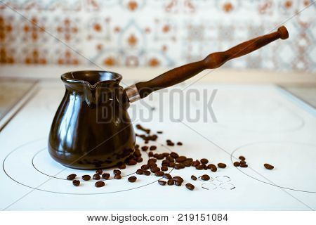 Hot Turkish coffee boiling on the stove