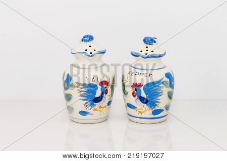 white ceramic pitchers with blue trim salt and pepper shaker set