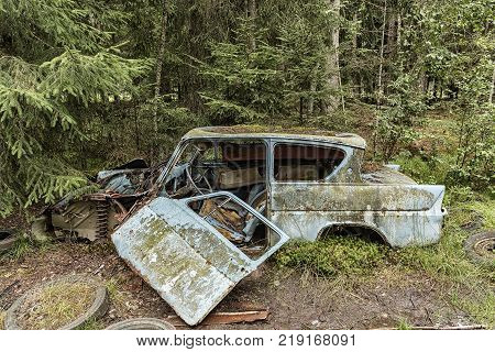 KIRKOE MOSSE SWEDEN - 28 JULY 2016: A car graveyard situated in a forest at Kirkoe Mosse Sweden.