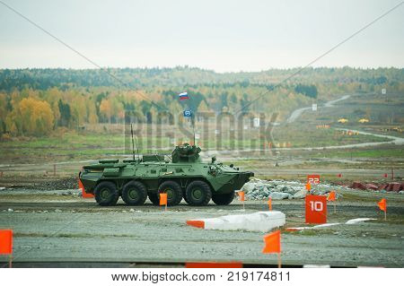 Nizhniy Tagil, Russia - September 25. 2013: BTR-82A armoured personnel carrier moves on shooting demonstration range. RAE-2013 exhibition