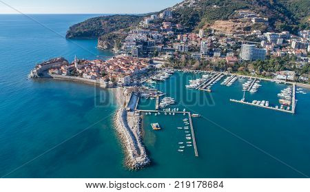 Old Town Budva with Morgen beach, Aerial view from sky. Montenegro