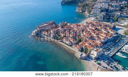 Old Town Budva with Morgen beach, Aerial view from sky. Montenegro