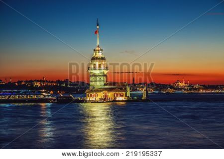 Wonderful sunset with Maiden's tower on Bosphorus and view of historical peninsula. Maiden's tower is one of landmarks of Istanbul, Turkey