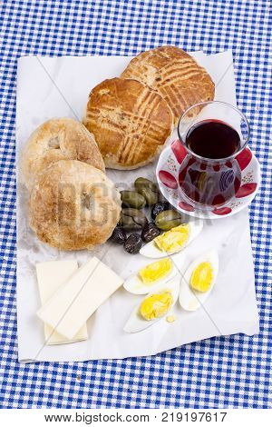 Turkish Borek Boyoz with egg and tea.