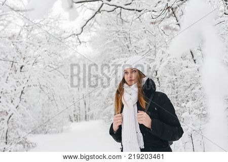 Beautiful Young Girl In A White Winter Forest