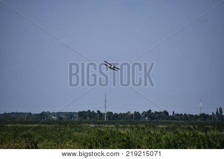 Aircraft agricultural aviation AN-2. The spraying of fertilizers and pesticides on the field with the aircraft.