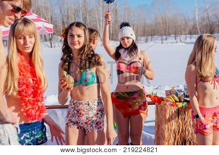 Novokuznetsk, Kemerovo region, Russia - 23 Feb, 2017 : White beaches of Siberia is an enterteiment activity where people playing beach games dressed in bikini in winter. Beach party in winter time