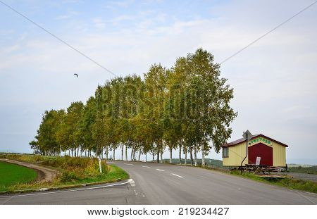Hokkaido Japan - Oct 2 2017. A wooden house with rural road in Hokkaido Japan. Hokkaido is the second largest island of Japan and the northernmost prefecture.
