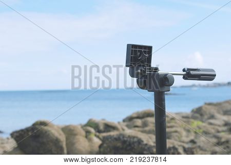 Tripod of camera prepare on beach with sea view in France europe with blackground blue sky.