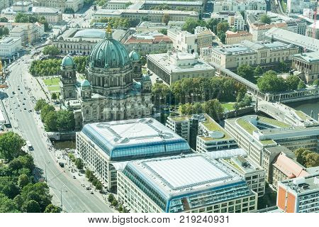 BERLIN GERMANY - AUGUST 28 2017; ciryscape with Museum Island and Berlin Cathedral green dome surrounded by cities historic museums and buildings.