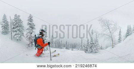 Man Skier Freerider Standing At Top Of Ridge, Adventure Winter Freeride Extreme Sport.