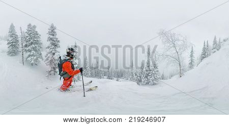 Man Skier Freerider Standing At Top Of Ridge, Adventure Winter Freeride Extreme Sport