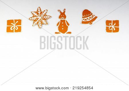 Gingerbread cookies over white background. Top view with. with copy space.