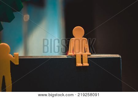 Abstract object in form of little men of yellow color printed on 3d printer close-up. Fused deposition modeling, FDM. Progressive modern additive technology. Concept of 4.0 industrial revolution