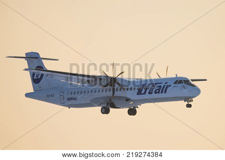 Novosibirsk, Russia - December 14, 2017: UTair ATR-72 comes to land at dawn