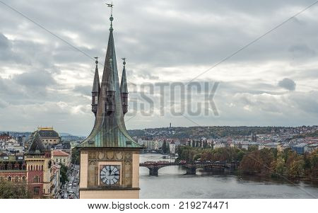 Prague, Czech Republic - October 10, 2017: Close up view on ancient Old Town Water Tower and Vltava river, Prague, Czech Republic. Staromestska vodarna.