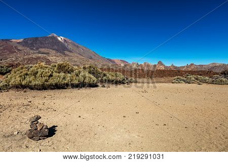 Teide National Park, Tenerife, Canary Islands colourful soil of the Montana Blanca volcanic ascent trail. This scenic hiking path leads up to the 3718 m Teide Peak, the highest peak in Spain