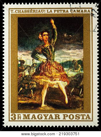 Moscow Russia - December 22 2017: A stamp printed in Hungary shows dancing woman painting "La Petra Camara" by Theodore Chasseriau (1819-1856) series "French Paintings" circa 1969