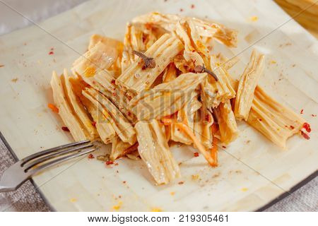 Yuba or fuju salad in a white bamboo plate