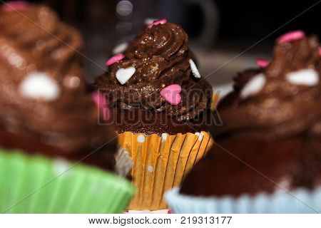 delicious chocolate cupcakes topped with sugar hearts