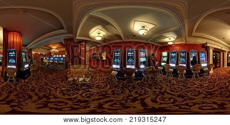 MINSK BELARUS - DECEMBER 3 2011: Panorama in interior in stylish hall in modern casino with players. Full 360 degree seamless panorama in equirectangular equidistant spherical projection