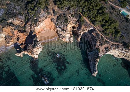 Aerial view of the coastline in the Praia do Alemao in Portimao Algarve Portugal; Concept for travel in Portugal and Algarve