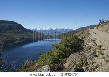 Landscape along the Carretera Austral next to the azure blue waters of Lago General Carrera in Patagonia, Chile. Lago Bertrand in the foreground.