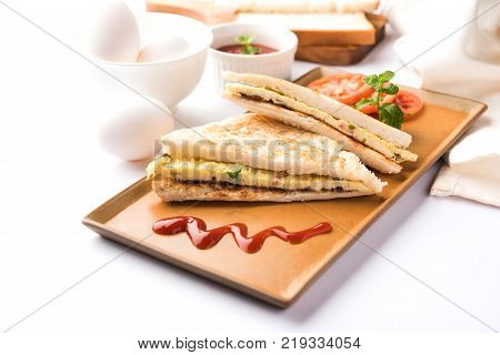 Indian Bread omelette / omlet / omlete sandwich served with tomato ketchup