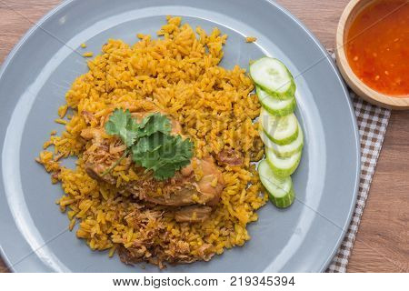 Chicken Biryani with rice and sauce. halal food (Khao Mok Gai)