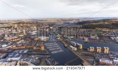 Editorial SWANSEA, UK - DECEMBER 12, 2017: An aerial view of the River Tawe in Swansea City, showing the new development around the Prince of Wales Dock, St Thomas, Port Tennant and Kilvey Hill