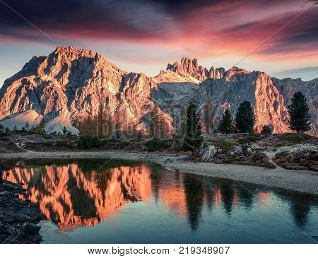 Splendid view of Limides Lake and Lagazuoi mountain. Colorful autumn morning in Dolomite Alps Falzarego pass Cortina d'Ampezzo lacattion Italy Europe. Artistic style post processed photo.