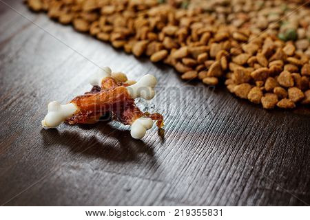 Calcium bones for dog feeding on wooden background