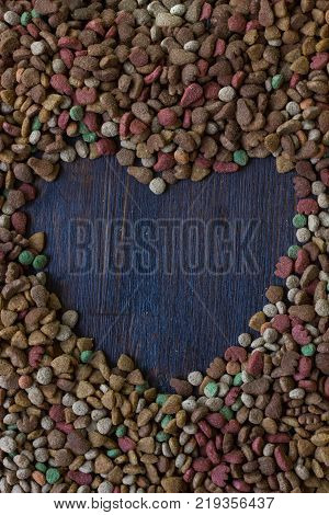 Shape of a heart on dry pet food. For text