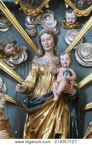 BELEC, CROATIA - NOVEMBER 17: Our Lady Queen of the Rosary statue on the altar in the Baroque Church of Our Lady of the Snow in Belec, Croatia on November 17, 2011.