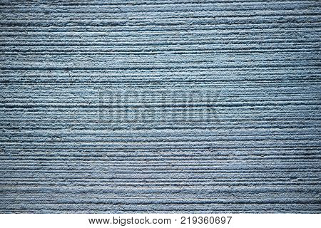 Concrete blue abstract background with lined texture