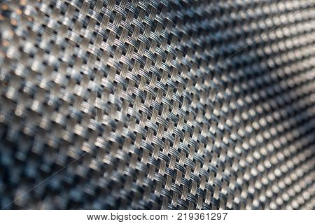 Abstract pattern or background. Grey diagonal grid closeup.