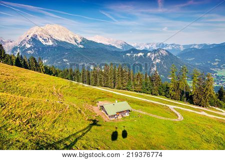 View from cableway cabine above the Konigsee lake on Schneibstein mountain ridge. Colorful summer morning on a border of Germany and Austrian Alps. Berchtesgaden location Bavaria Germany Europe.