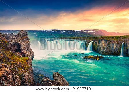 Summer morning scene on the Godafoss Waterfall. Colorful sunrise on the on Skjalfandafljot river Iceland Europe. Artistic style post processed photo.