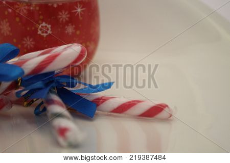 Christmas decorations with adornment sugar sticks with blue ribbon