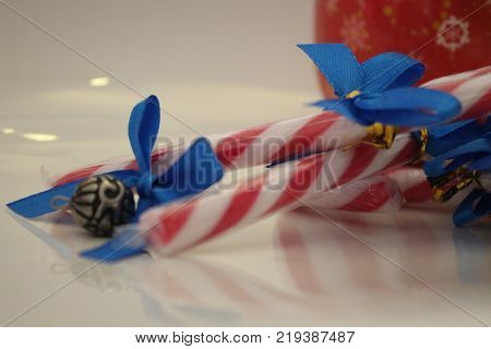 Christmas decorations with adornment sugar sticks with blue ribbon