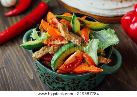 Vegetarian variant of mexican fachitos on wooden board.