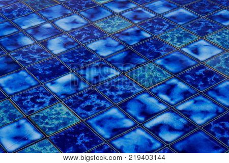 Blue ceramic mosaic in a pool on bali