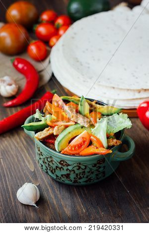 Vegetarian variant of mexican fachitos on wooden board.