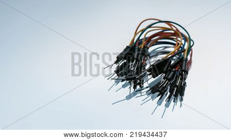 jump wires cables kit on white background. microelectronics craftsmanship. device components.