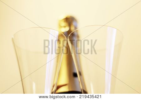 Bottle of shampagne and a pair glasses
