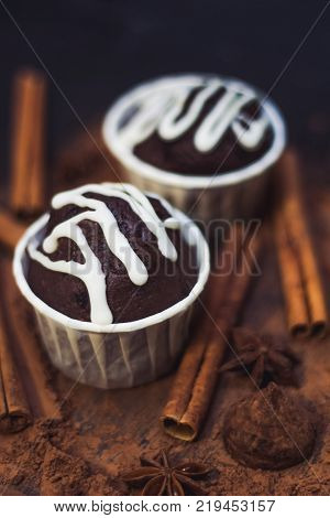 homemade spicy chocolate cupcake sweets and spices mess on the table