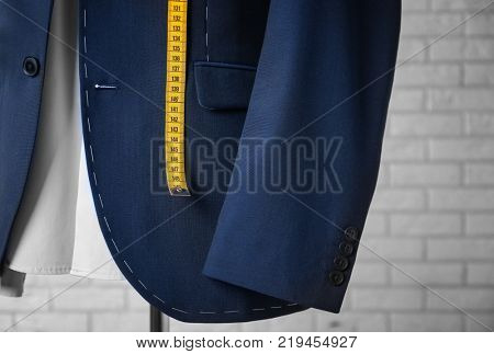 Semi-ready suit on mannequin indoors, closeup