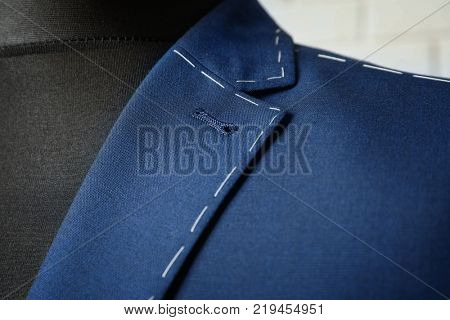 Semi-ready suit on mannequin indoors, closeup