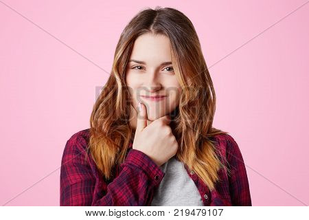 Headshot Of Unhappy Sorrorful Female Curves Lips, Looks Desperately At Camera, Being Upset To Hear B