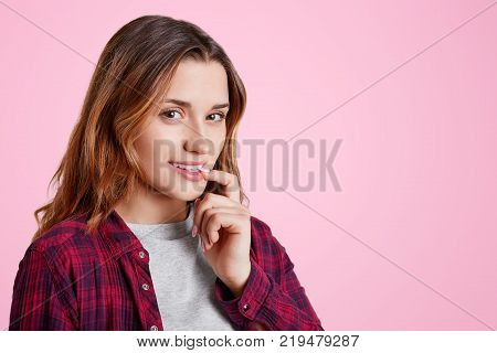 Headshot Of Unhappy Sorrorful Female Curves Lips, Looks Desperately At Camera, Being Upset To Hear B